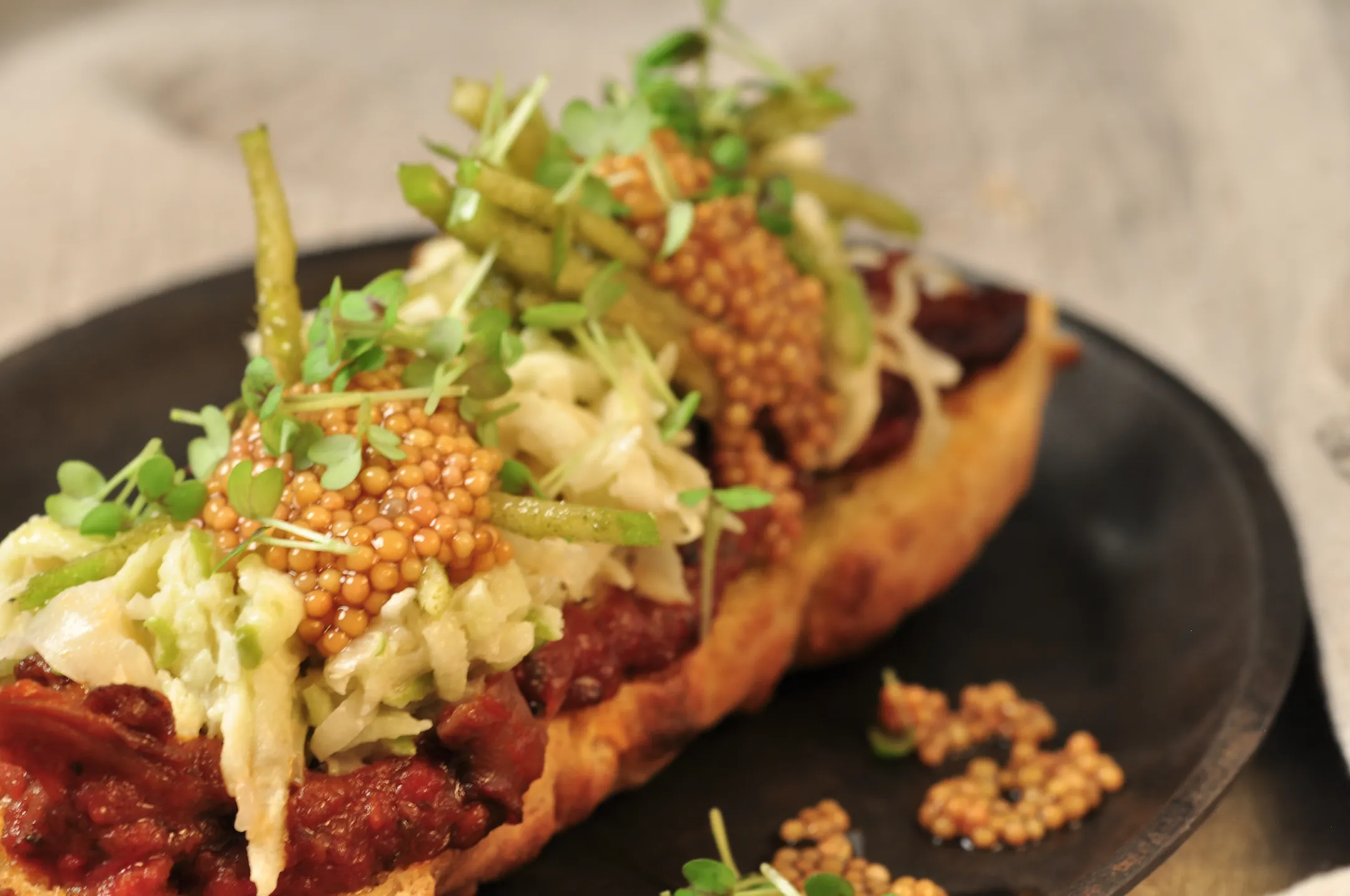  Close up on colorful vegetarian food on a black plate