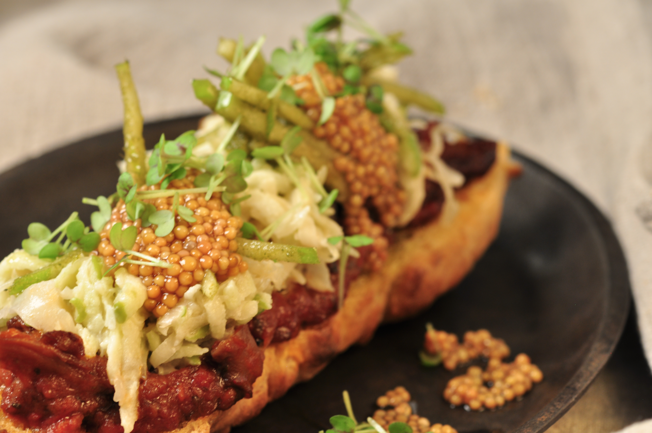 Close up on colorful vegetarian food on a black plate