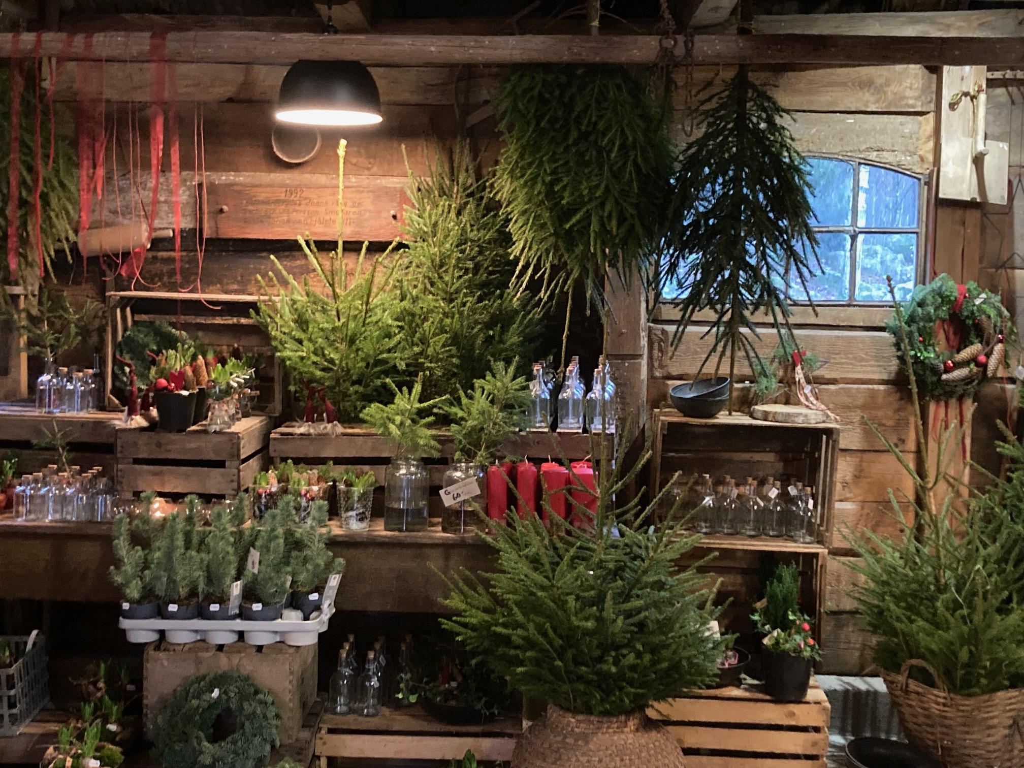 Things made of pine tree and red Christmas candles in a Christmas market