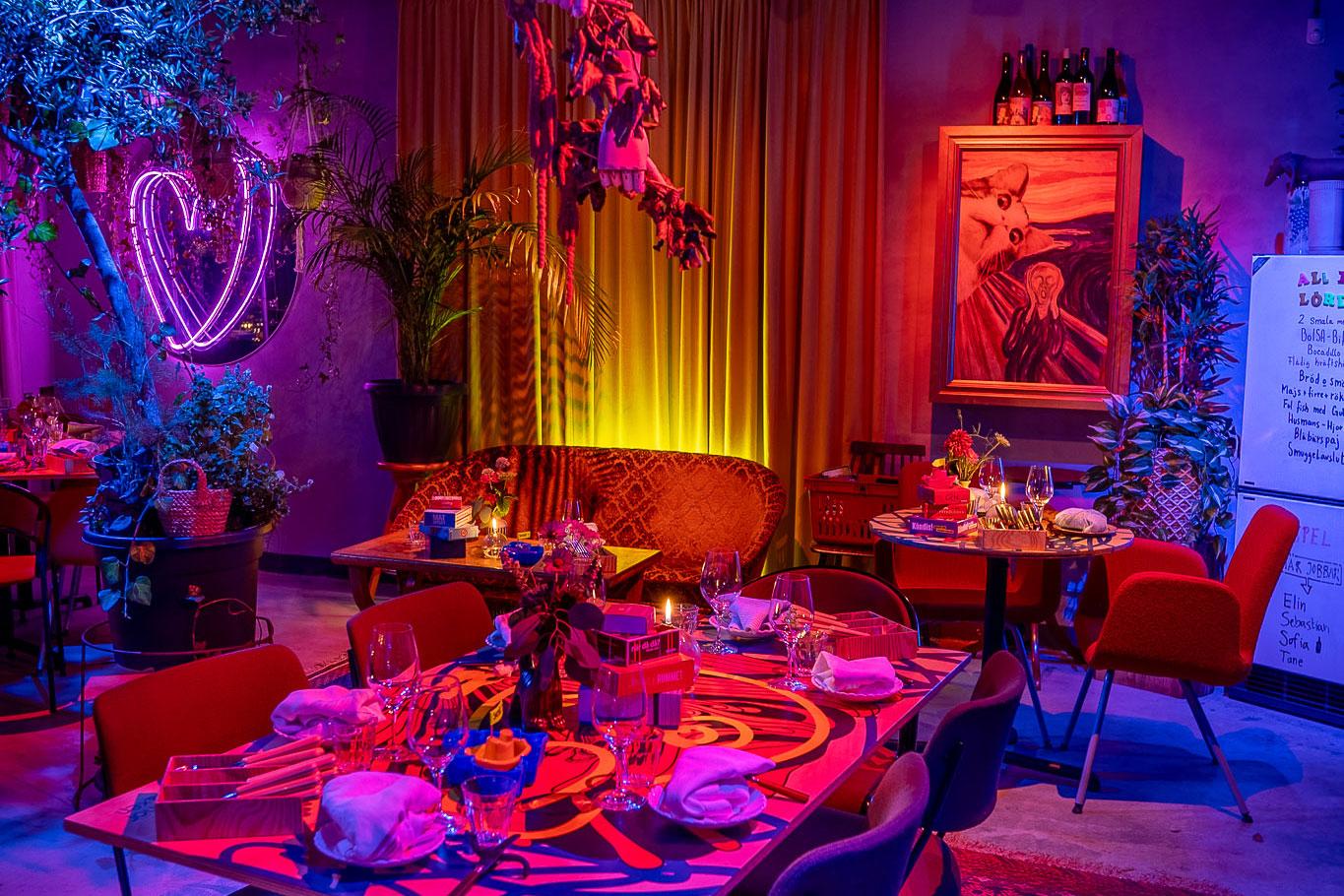 Dimly lit restaurant with richly textured carpets and draperies creating an intimate atmosphere
