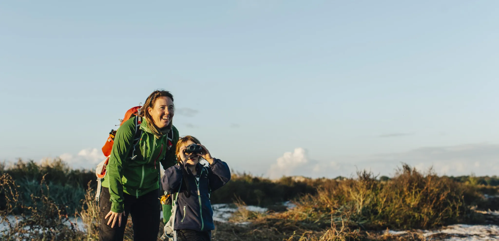 Mom and son scouts for wildlife in Måkläppen