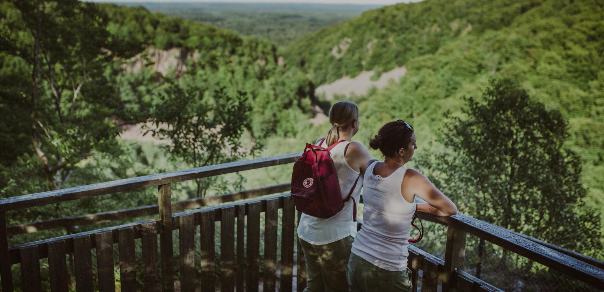 Two women enjoying the view over a valley in Söderåsen national park