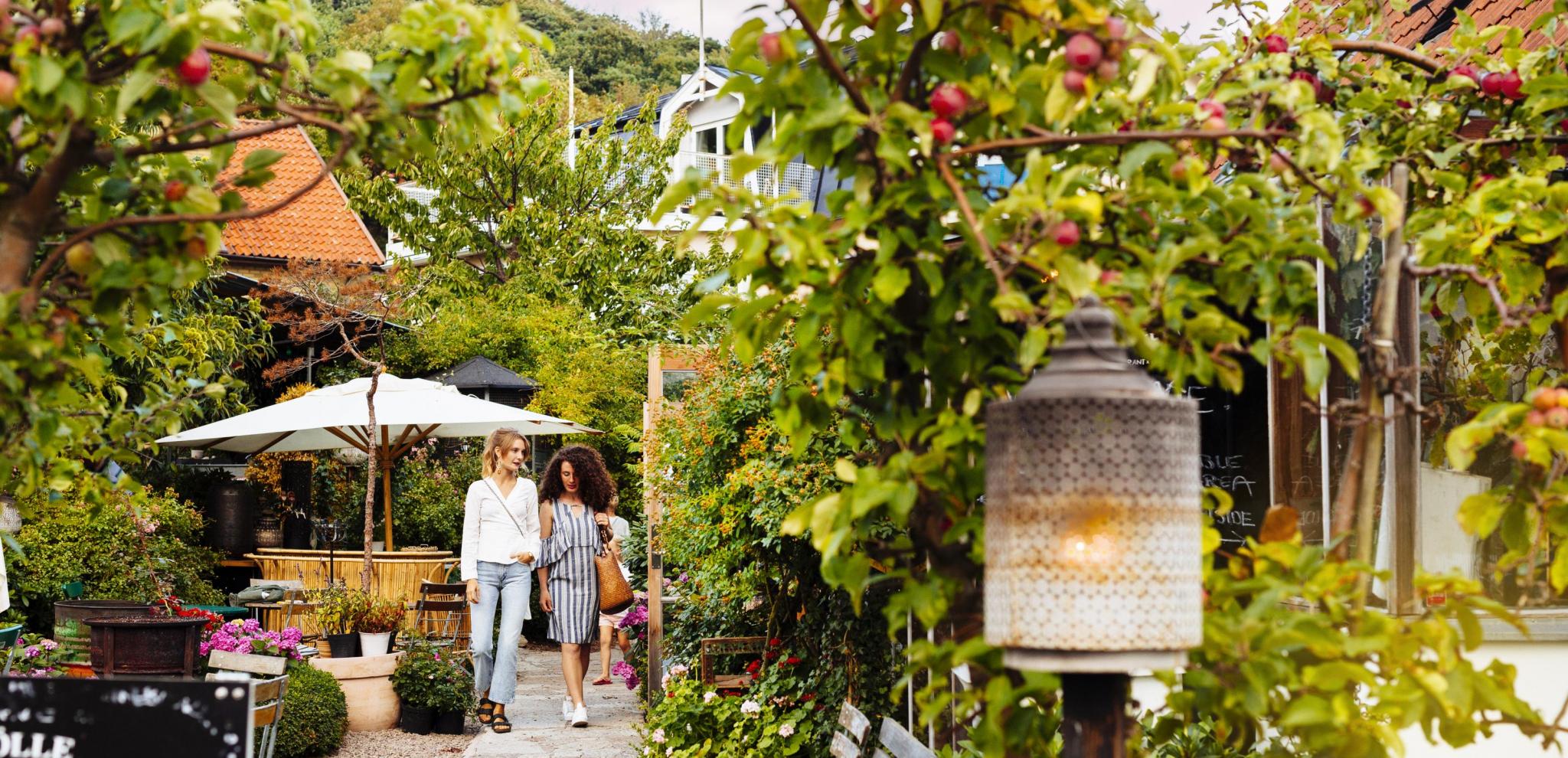 Two women in a picturesque garden