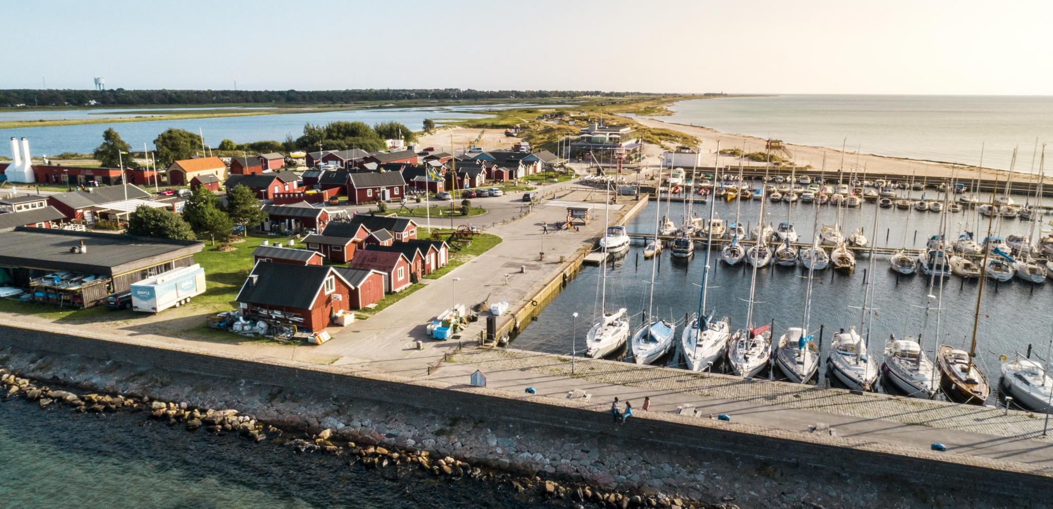 View from above of Skanör harbor with boats and small fishermans huts