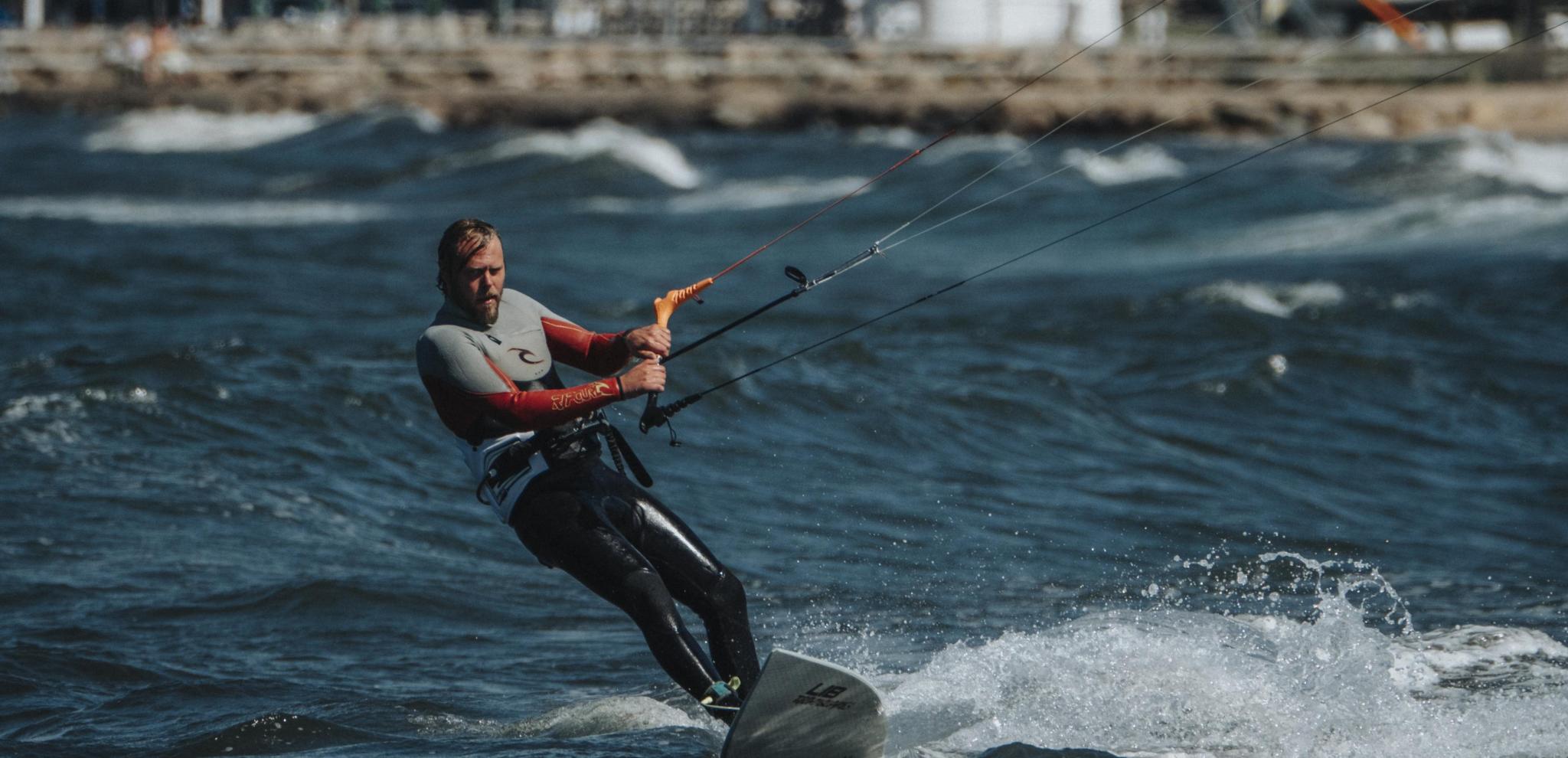 A man kitesurfing