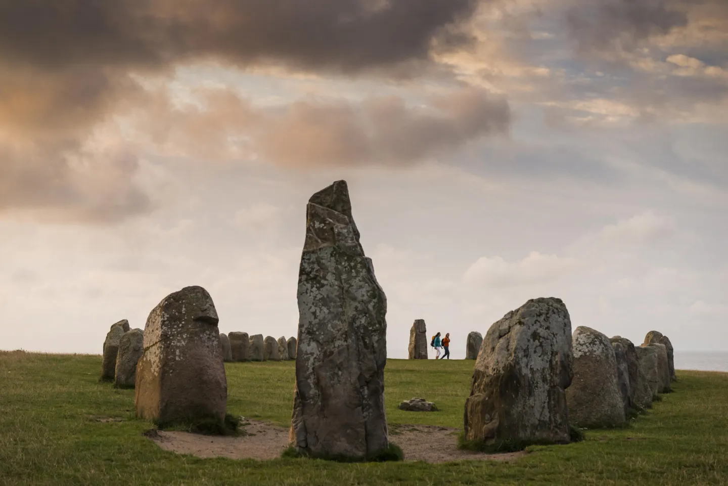 Ales stones with two women in the background 