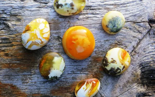 colorful Ember stones on a wooden surface 