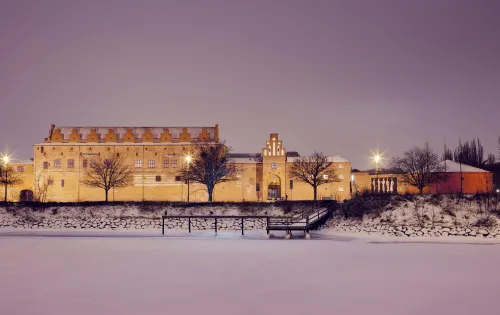 Malmöhus castle in the wintertime covered with snow at night 