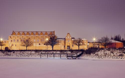 Malmöhus castle in the wintertime covered with snow at night 