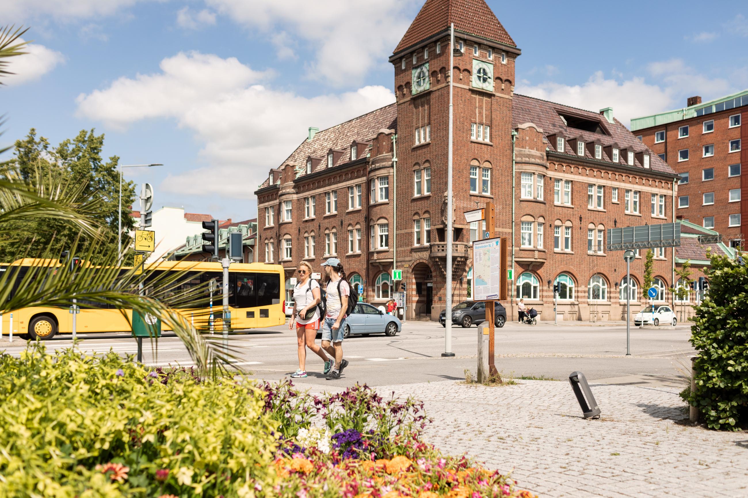 A sunny day in the center of Trelleborg. Buses, cars and people are passing by.