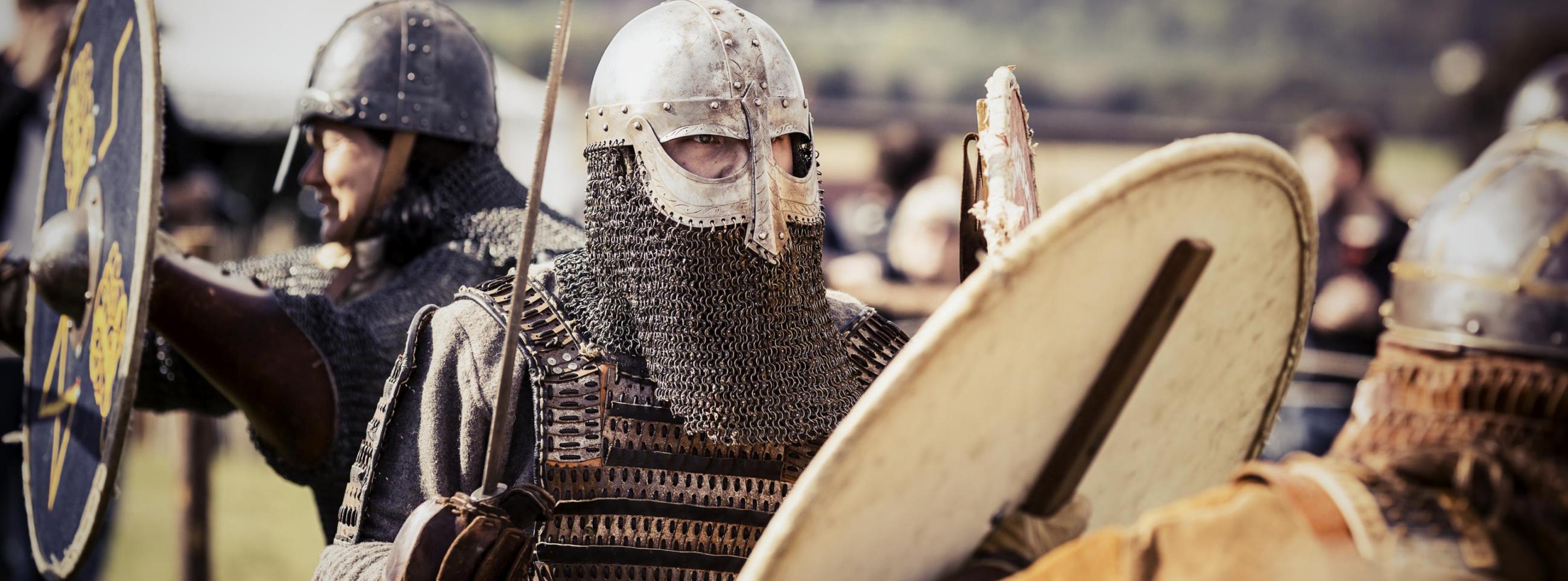 Vikings with sword and armour in a vikingvillage