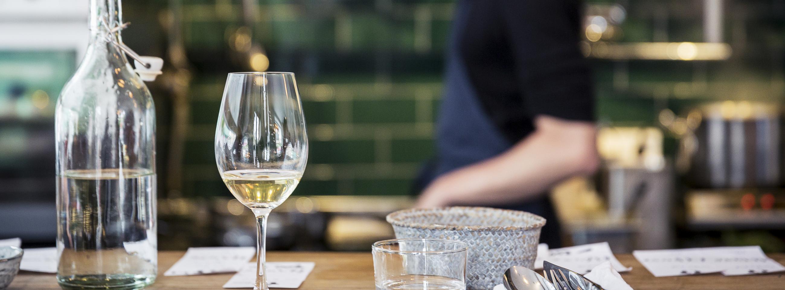 Bartop tablesetting with bartender in background cropped