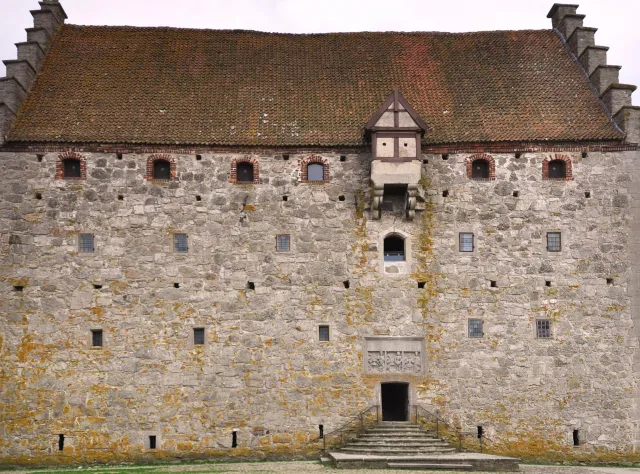 Old building made of stone with narrowing stairs to the entrance