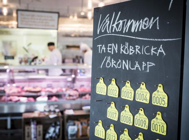 A welcome sign in front of the meat counter at Lindegren's meat shop in Ängelholm
