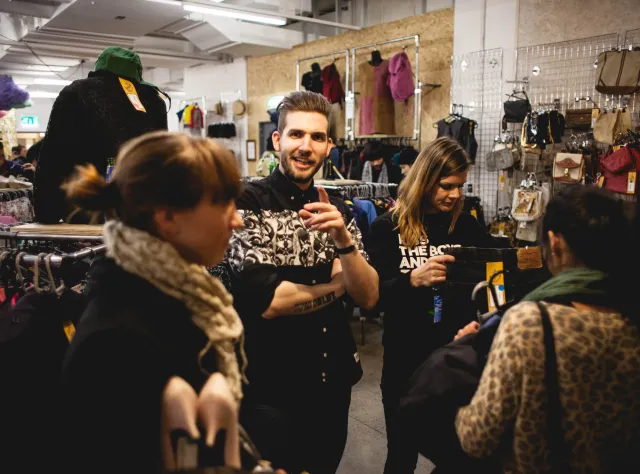 Four persons looking for clothes © Olle Enqvist