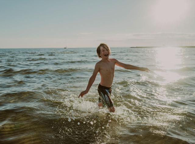 a child bathing in the sea in Borstahusen in Skåne