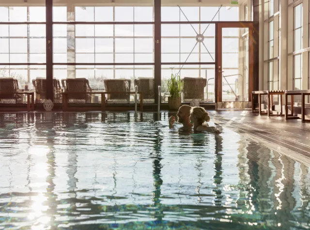 A couple bathing in a relaxing spa pool 