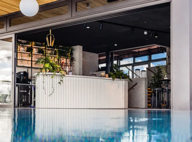 A view of a rooftop bar and a pool