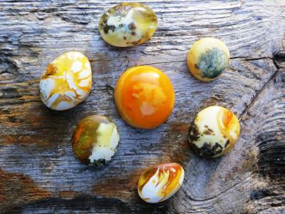 colorful Ember stones on a wooden surface 