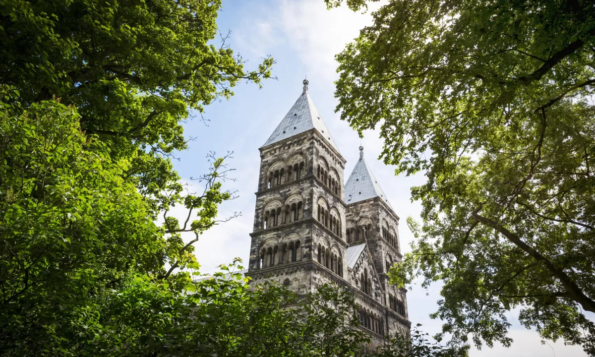 View over the Lund Cathedral through the green tree tops
