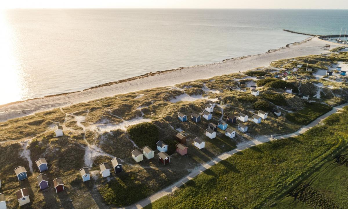 View of beach cabins from above at Skanör beach early in the morning