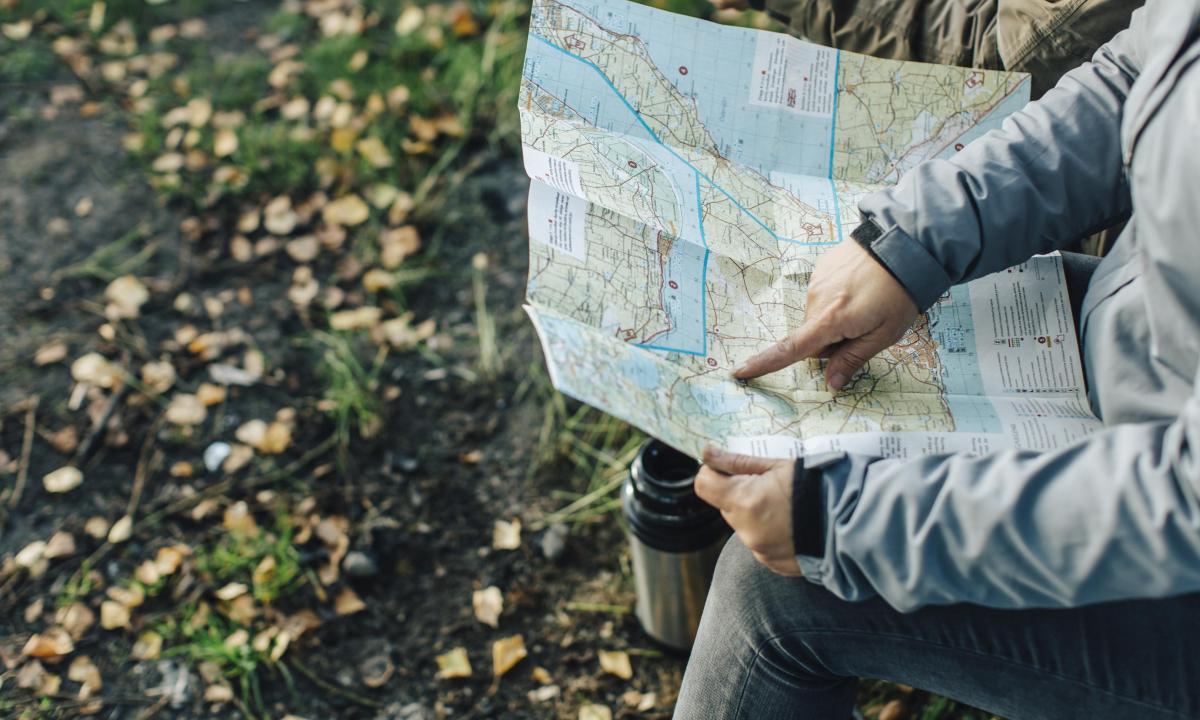 Person pointing at a map